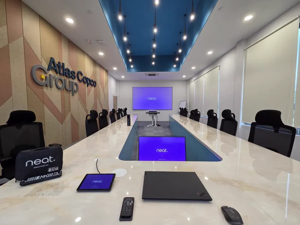Atlas Copco Group boardroom with a Neat collaboration display at the head of the table