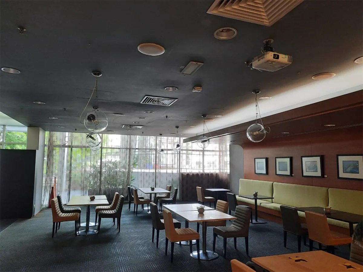 Truffle restaurant dining room with a ceiling projector