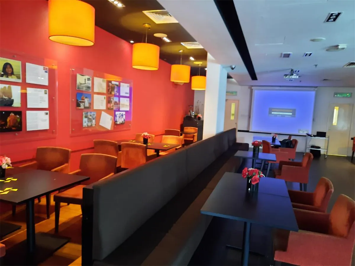 Tangerine restaurant with a projection screen at the far wall